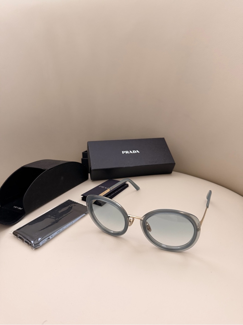 Prada 100% Round Sunglasses in Light Grey with Gold Trim